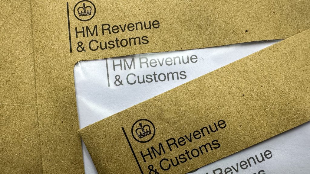 HMRC debt tax letters. Brown HMRC envelopes. An envelope from the UK tax office HM Revenue and Customs.